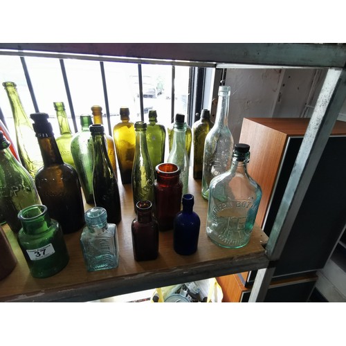 37 - Collection of approx 25 vintage coloured bottles inc beer bottles, medicine and water bottles etc