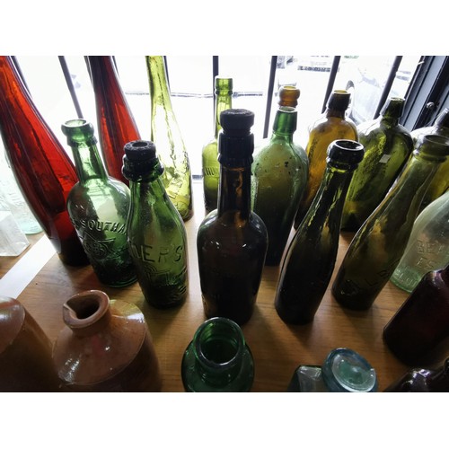 37 - Collection of approx 25 vintage coloured bottles inc beer bottles, medicine and water bottles etc