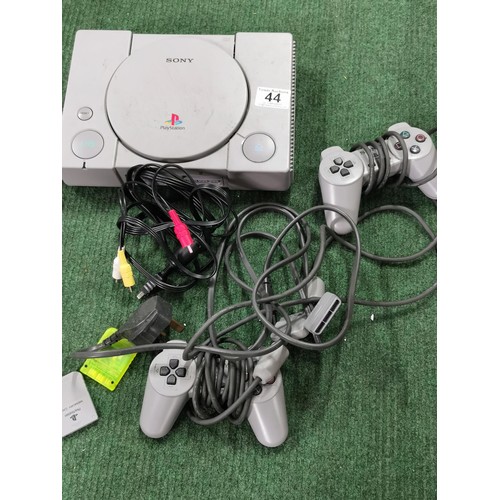 44 - Sony Playstation inc 2 Controllers and Power Cable, and memory card