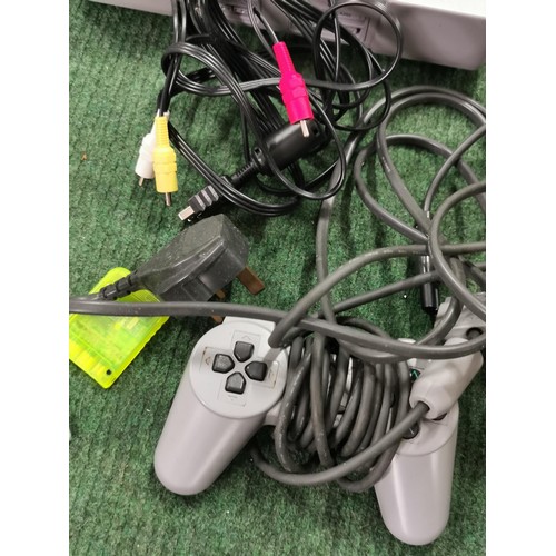 44 - Sony Playstation inc 2 Controllers and Power Cable, and memory card