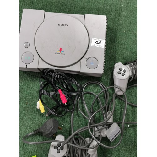 44 - Sony Playstation inc 2 Controllers and Power Cable, and memory card