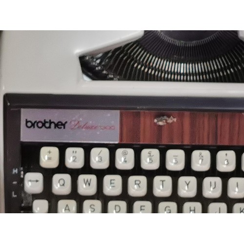 56 - Cased Brother Deluxe 1300 Vintage Typewriter in good order.