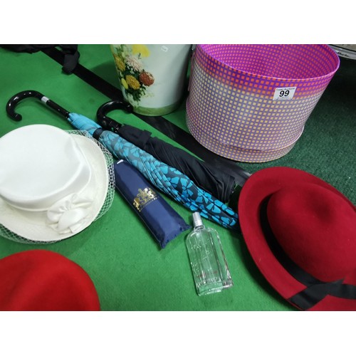 99 - Collection of ladies accessories inc hats along with a wedding hat, umbrellas inc Buckingham Palace ... 