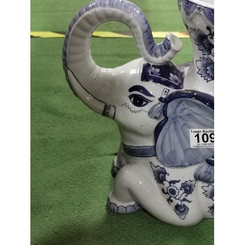 109 - Large ceramic elephant formed planter in a blue and white design. Planter stadns at 31cm high, 38cm ... 