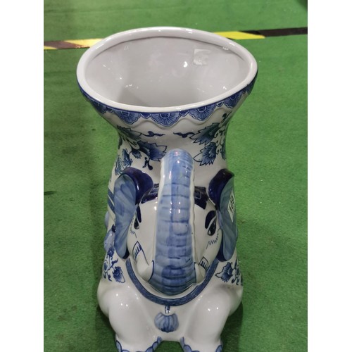 109 - Large ceramic elephant formed planter in a blue and white design. Planter stadns at 31cm high, 38cm ... 