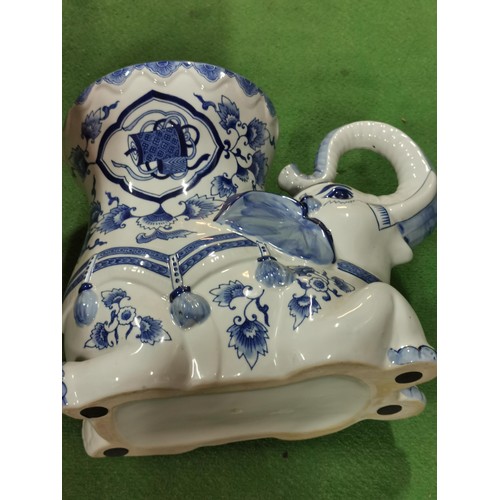 109 - Large ceramic elephant formed planter in a blue and white design. Planter stadns at 31cm high, 38cm ... 