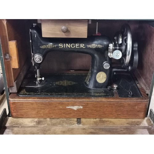 168 - Singer sewing machine in a fitted case with drawer and accessories. Model 99k - Year 1933. Model No.... 