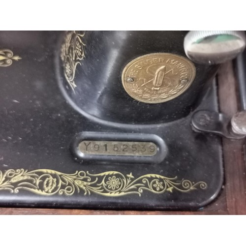 168 - Singer sewing machine in a fitted case with drawer and accessories. Model 99k - Year 1933. Model No.... 