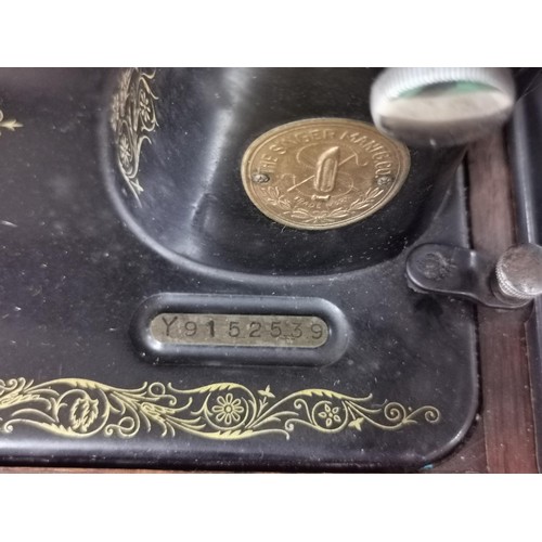 168 - Singer sewing machine in a fitted case with drawer and accessories. Model 99k - Year 1933. Model No.... 