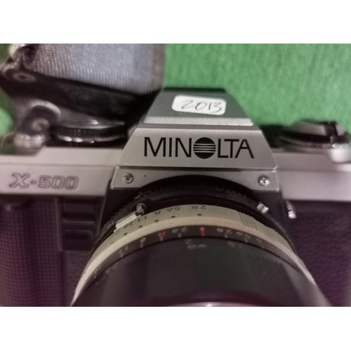 176 - Minolta X500 SLR camera with a 14mm lens along with a Soligor lens, all in good order