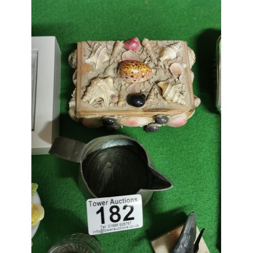 182 - Basket of collectables inc a nut cracker, ladies dressing table set, vintage inkwell bottle with Cel... 