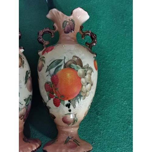 185 - 2x fruit design Staffordshire urns standing 30cm high with guilded edges, one is AF