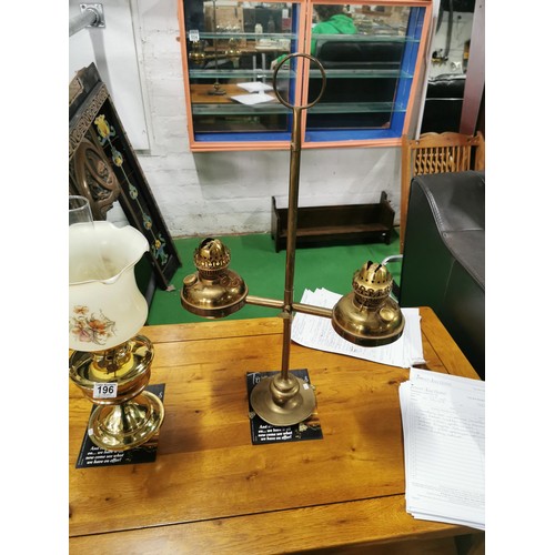 196 - Vintage double bowled claw footed oil lamp with no chimney along with a modern reproduction oil lamp... 