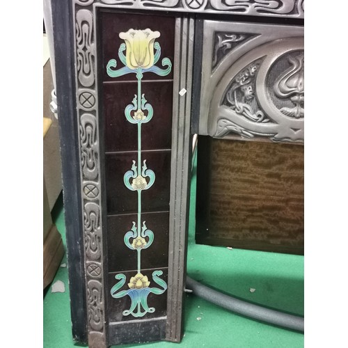 197 - Reproduction art deco style cast iron fire place with 10x inset reproduction tiles with a floral des... 