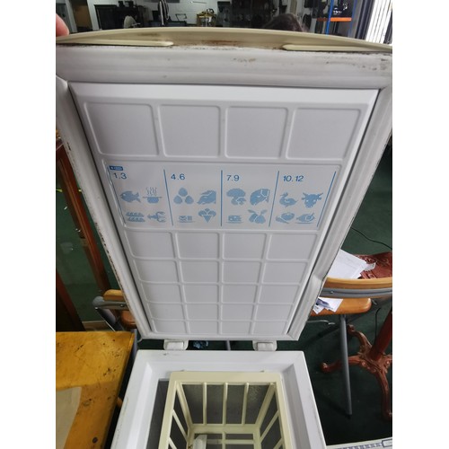 398 - Eurocold ITF57W slim line freezer with basket. Height of 85cm x width 35cm x depth 56cm