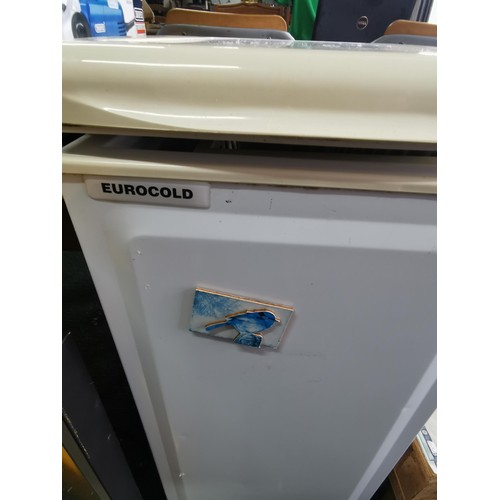 398 - Eurocold ITF57W slim line freezer with basket. Height of 85cm x width 35cm x depth 56cm