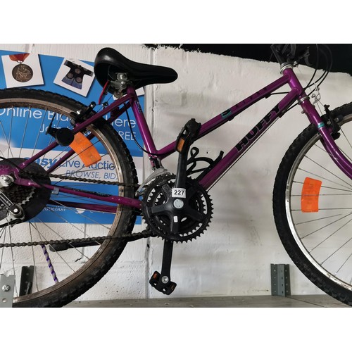 227 - 18 inch ladies Saturn Huffy Purple 18 speed mountain bike with Shimano gears in overall good conditi... 