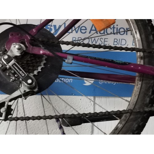 227 - 18 inch ladies Saturn Huffy Purple 18 speed mountain bike with Shimano gears in overall good conditi... 