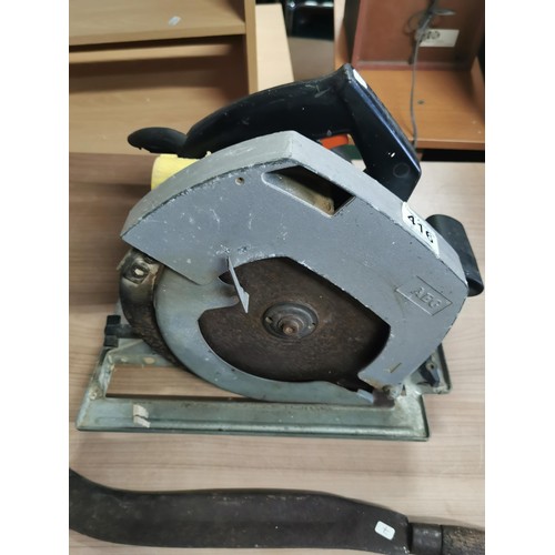 416 - AEG 110w circular saw along with a bill hook. bill hook measures 56cm