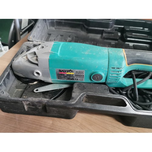 428 - Cased heavy duty black spur 230mm angle grinder with 6x spare blades along with a comprehensive 215 ... 