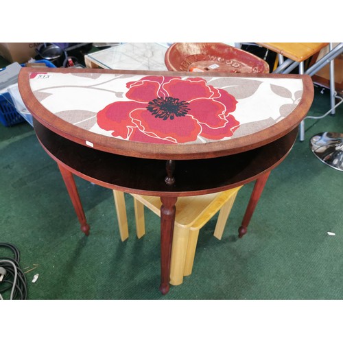 513 - Half Moon side table with material floral top, detachable legs. Height of 74cm x length 76cm x depth... 