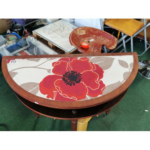 513 - Half Moon side table with material floral top, detachable legs. Height of 74cm x length 76cm x depth... 