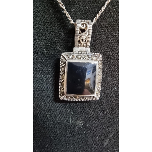 254 - Ornate vintage 925 Silver pendant inset with a black Onyx stone surrounded by Marcasite stones set o... 