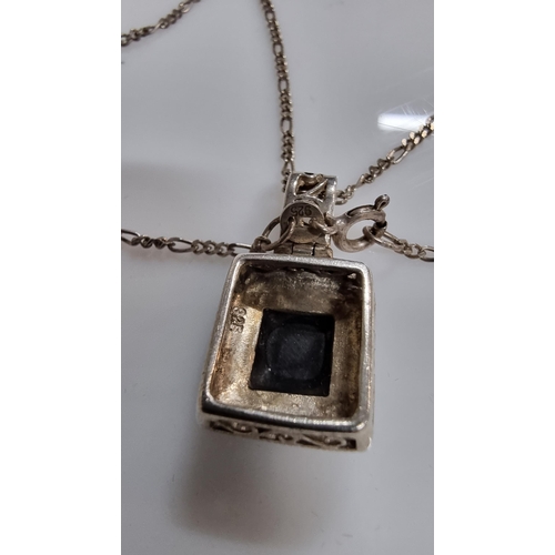 254 - Ornate vintage 925 Silver pendant inset with a black Onyx stone surrounded by Marcasite stones set o... 