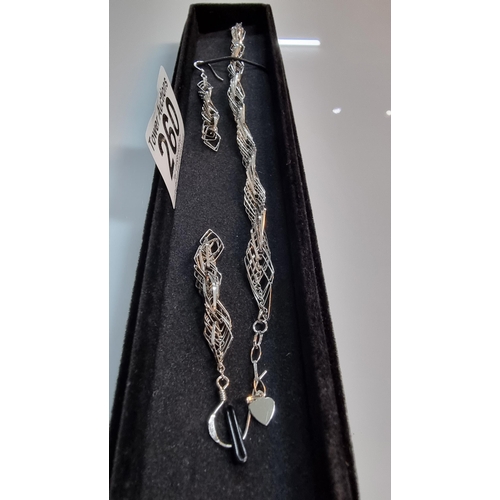 260 - An unusual 925 Silver wire work diamond link bracelet & matching earring set. All in good order. Bra... 