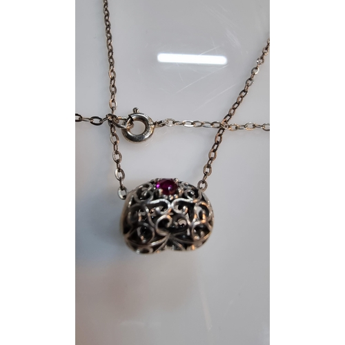 265 - Genuine Pandora heart pendant with a Ruby stone to the centre, set on 17