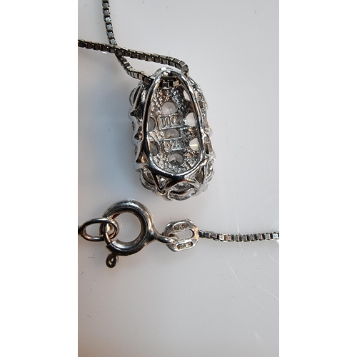 266 - 925 Silver pendant encrusted with CZ stones set on a 16