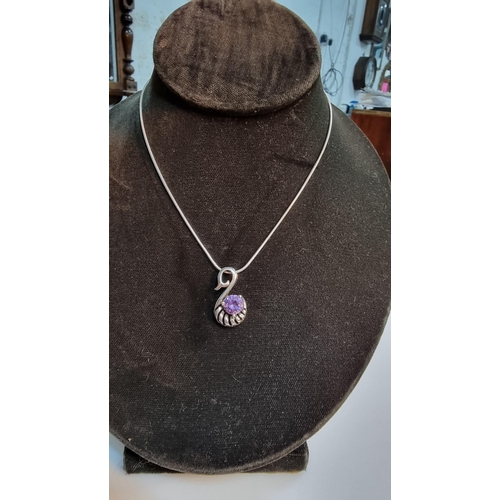 268 - Pretty 925 Silver swan formed pendant inset with large purple glass crystal stone. Set on 16