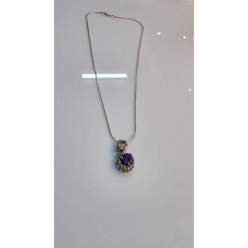 268 - Pretty 925 Silver swan formed pendant inset with large purple glass crystal stone. Set on 16