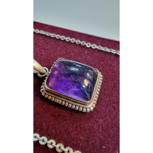 270 - 925 silver pendant inset with a large square amethyst gemstone. Set on a 16