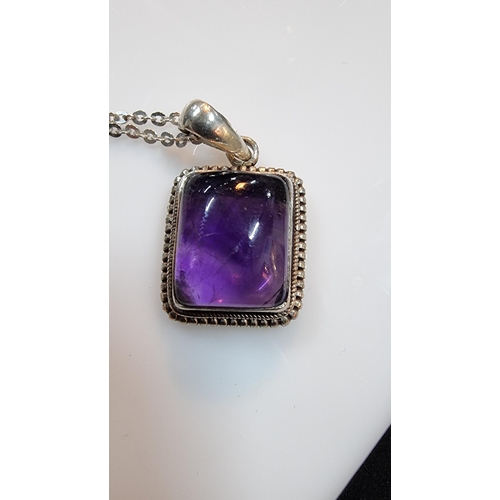 270 - 925 silver pendant inset with a large square amethyst gemstone. Set on a 16