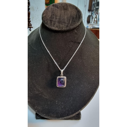 270 - 925 silver pendant inset with a large square amethyst gemstone. Set on a 16