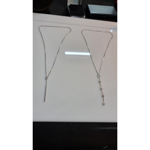 273 - 2x 925 Silver tassel drop necklaces one with rose drop design other with bar design. Both are marked... 