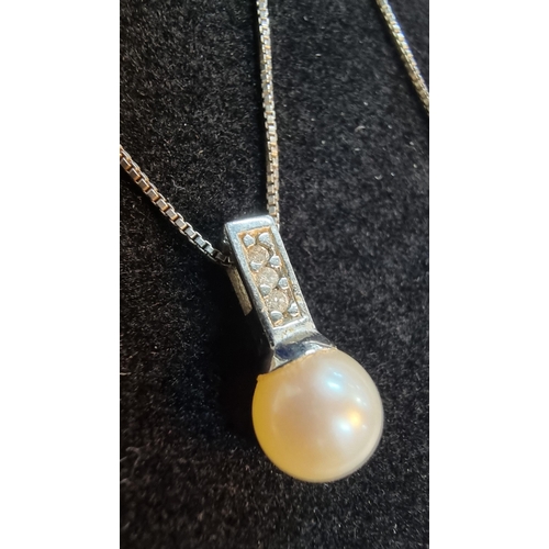 274 - Good quality 925 Silver pendant with a freshwater pearl, inset with 3x genuine small diamonds set on... 