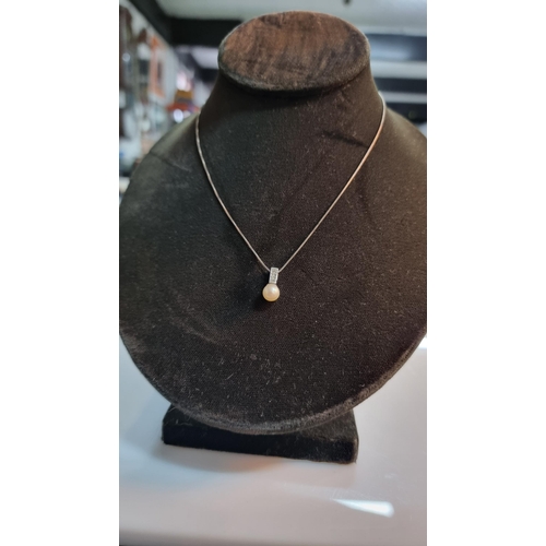 274 - Good quality 925 Silver pendant with a freshwater pearl, inset with 3x genuine small diamonds set on... 