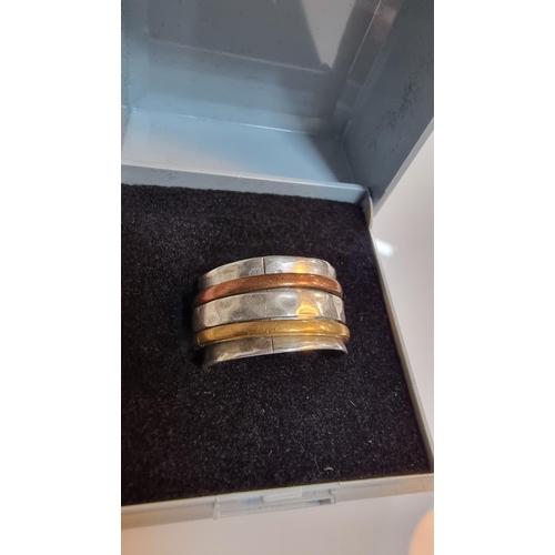 277 - Unusual 925 Silver hand beaten ring with three rotating bands including rose gold plated & yellow go... 