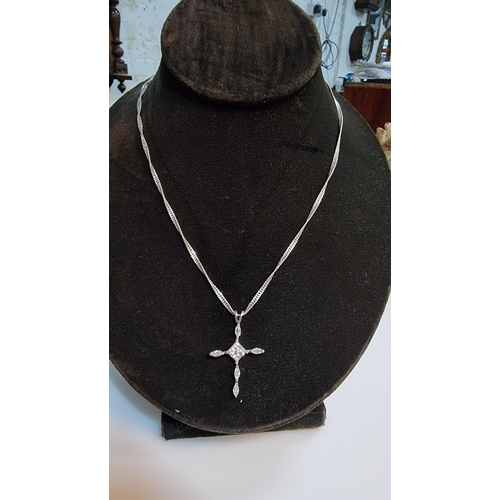 279 - 925 Silver crucifix pendant inset with quantity of CZ stones set on 18