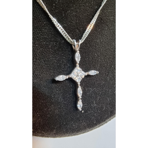 279 - 925 Silver crucifix pendant inset with quantity of CZ stones set on 18