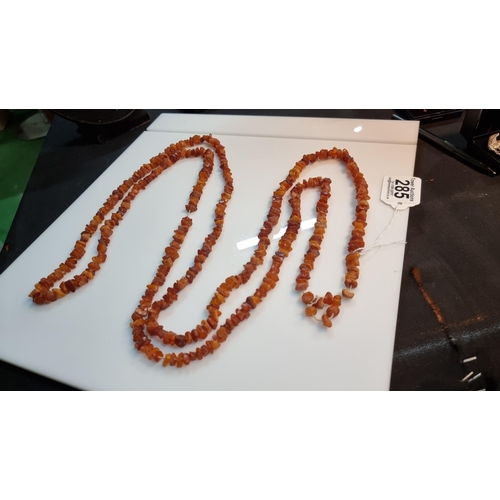 285 - Very long necklace with various amber beaded chips. in good clean condition. Total length of 100cm o... 