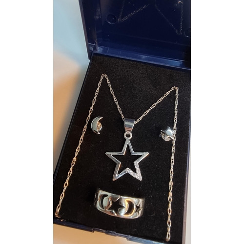 291 - Matching 925 Silver jewellery set inc. star pendant, moon & star earrings & a moon & star ring. All ... 