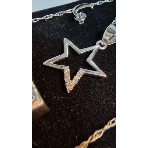 291 - Matching 925 Silver jewellery set inc. star pendant, moon & star earrings & a moon & star ring. All ... 