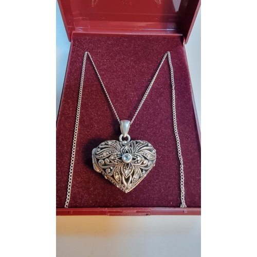 306 - Good quality ornate 925 Silver heart locket pendant with pierced design, with a aquamarine stone to ... 