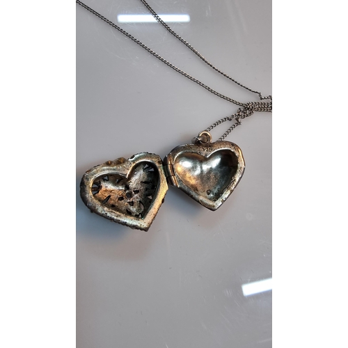 306 - Good quality ornate 925 Silver heart locket pendant with pierced design, with a aquamarine stone to ... 