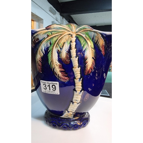 319 - Large vintage Beswick palm tree vase with a blue outer glaze. In good condition. Height 21.5cm, widt... 