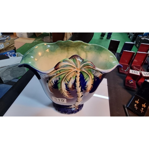 319 - Large vintage Beswick palm tree vase with a blue outer glaze. In good condition. Height 21.5cm, widt... 