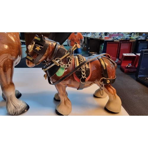 329 - Kelsboro Ware horse figure along with a small Melba ware shire horse figure. Largest horse measures ... 